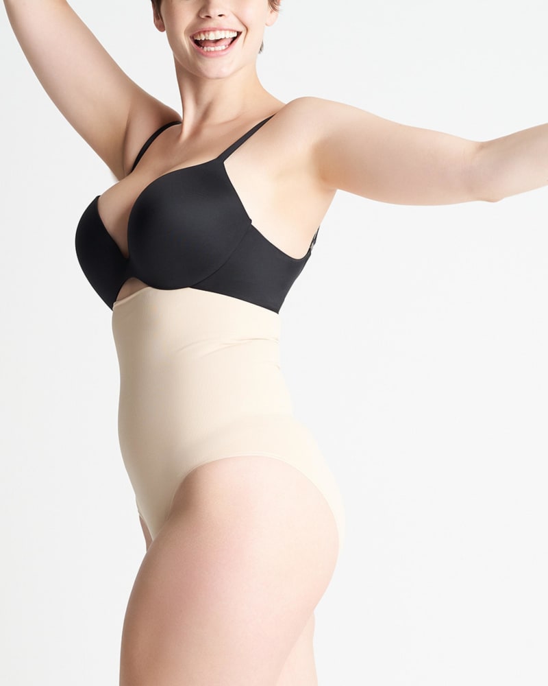 Side of a model wearing a size L/XL Cooling FX High-Waisted Brief in Tan by Yummie. | dia_product_style_image_id:235554